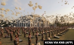 White balloons are released from around the graves of North Korean soldiers during the April 26 opening of the Memorial Museum of Combat Feats in Overseas Military Operations.