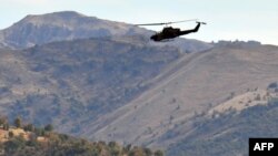 Turkey -- A Turkish military helicopter flies over a mountain in Yemisli, Hakkari province near the Iraqi border, 22Oct2011