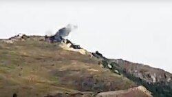 Облако дыма после предполагаемого обстрела армянскими военными Товузского района Азербайджана.