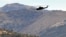 Turkey -- A Turkish military helicopter flies over a mountain in Yemisli, Hakkari province near the Iraqi border, 22Oct2011