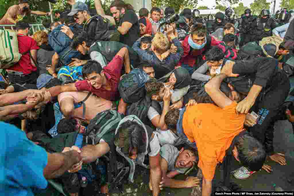 This photograph of refugees on the Hungary-Serbia border by Jan Zatorsky was named the winner of the Czech Press Photo Photograph of the Year contest for 2015.