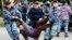 Police detain opposition supporters during a protest calling for free and fair elections during the presidential election in Nur-Sultan, Kazakhstan, in June 2019. 