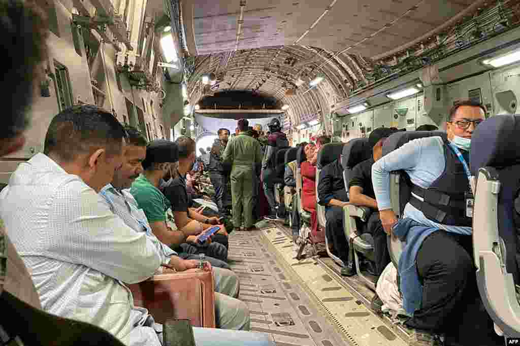 Indian nationals on board an Indian military aircraft wait to leave Kabul airport on August 17.