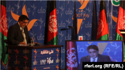 RFE/RL's Akbar Ayazi asking question during the February 15 presidential debate jointly sponsored by RFE/RL and RTA.