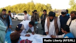 A handful of young Afghan activists are urging people in Helmand to sign long sheets of white paper and also leave their cellphone numbers.