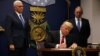 U.S. President Donald Trump signing the executive order on immigration at the Pentagon on January 27.