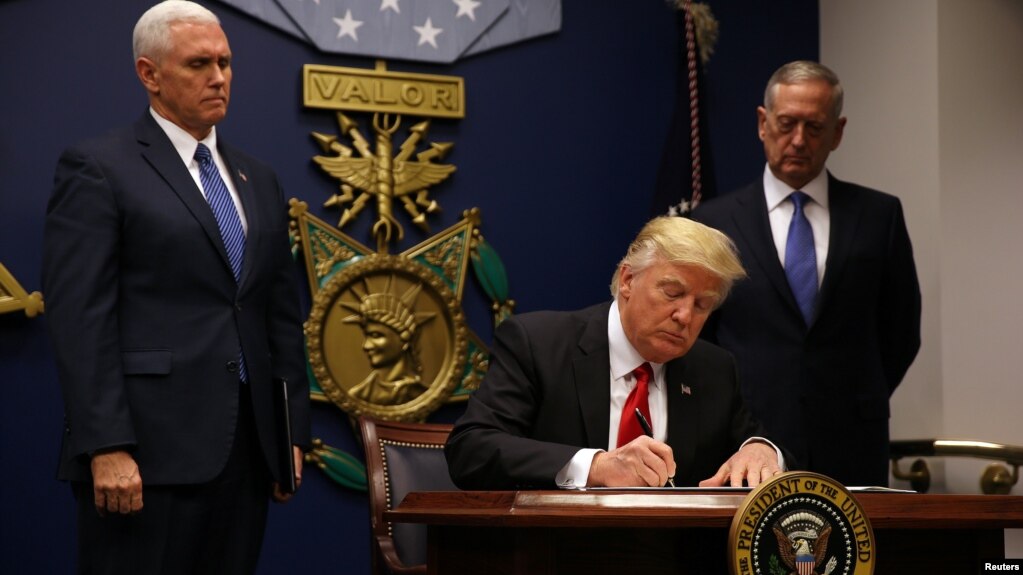 U.S. President Donald Trump signing the executive order on immigration at the Pentagon on January 27.