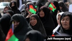 FILE: Members of Afghan Hazara community rally to demand the government bring security in Herat in September 2017.