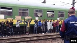 Мігранты ў Вугошчыне пратэстуюць, бо іх не пускаюць у Нямеччыну. 4 верасьня 2015 году