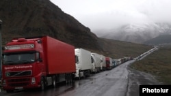 Georgia - Armenian and other heavy trucks are lined up on a road leading to the Georgian-Russian border crossing at Upper Lars, 6May2016.