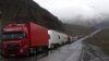 Georgia - Armenian and other heavy trucks are lined up on a road leading to the Georgian-Russian border crossing at Upper Lars, 6May2016.