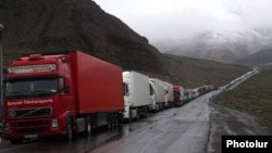 Georgia - Armenian and other heavy trucks are lined up on a road leading to the Georgian-Russian border crossing at Upper Lars, 6May2016.