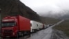 Georgia - Armenian and other heavy trucks are lined up on a road leading to the Georgian-Russian border crossing at Upper Lars, 6May2016.