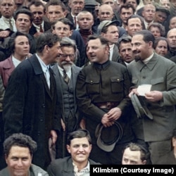 Soviet leaders Josef Stalin, Mikhail Kalinin (wearing glasses), Kliment Voroshilov, and Lazar Kaganovich (standing left to right) in 1930. Among other acts of political terror, all four men were behind the 1940 execution of some 22,000 of Poland’s top military officers, policemen, and academics seen as likely to resist Soviet communist rule in the Katyn massacre. Shirnina says this photo was also posted without problem on Facebook and Instagram.
