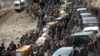 Mourners carry the coffins of the Kurdish victims of a Turkish air raid in its Sirnak province on December 30.