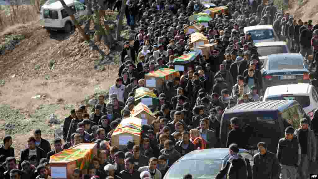 Kurds carry the coffins of victims of a Turkish air raid outside the district hospital in Uludere, Sirnak province, on December 30. (AFP/Bulent Kilic)