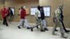 Сотрудники ФСБ конвоируют украинских моряков в здании суда