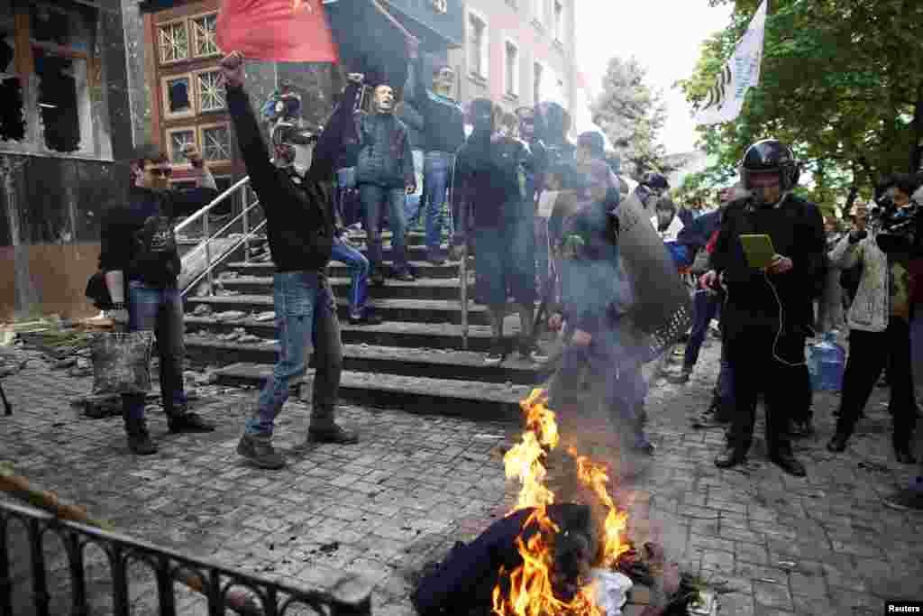 Pro-Russia activists burn uniforms outside the regional prosecutor&#39;s office in Donetsk on May 1. (Reuters/Marko Djurica)