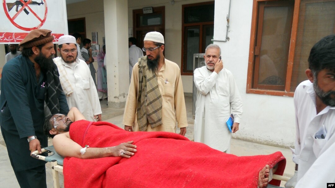 A victim of a bomb attack on an election rally in the northwestern town of Hangu, Pakistan on May 7 is wheeled toward medical assistance.