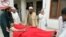 A victim of a bomb attack on an election rally in the northwestern town of Hangu, Pakistan on May 7 is wheeled toward medical assistance.