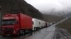 Georgia - Armenian and other heavy trucks are lined up on a road leading to the Georgian-Russian border crossing at Upper Lars, 6May2016.