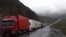 Georgia - Armenian heavy trucks are lined up on a road leading to the Georgian-Russian border crossing at Upper Lars, 6May2016.