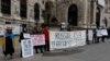 Anti-Ukraine-war protestors stand outside Vienna's Hofburg Palace during a Parliamentary Assembly of the OSCE this week. 