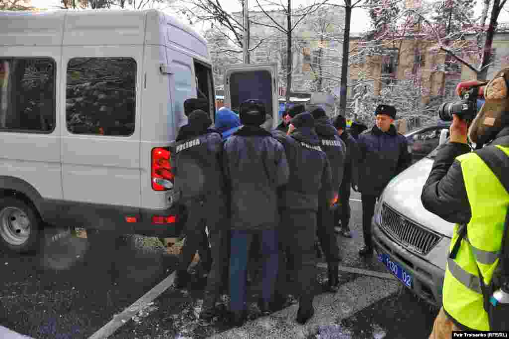 Police forced a demonstrator into a van in Almaty. Around the same time, more than 50 people were arrested in the capital, Nur-Sultan.&nbsp;