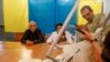 UKRAINE -- Members of a local electoral commission empty a ballot box at a polling station after a parliamentary election in Kyiv, Ukraine July 21, 2019