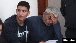 Armenia - Opposition activist Shant Harutiunian (R) and his son Shahen stand trial in Yerevan, 15Oct2014.