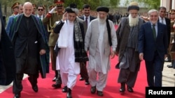 FILE: (L-R) Former Afghan President Hamid Karzai, Afghan President Ashraf Ghani, Afghan warlord Gulbuddin Hekmatyar, Afghan former Jihadi leader Abdul Rabb Rasool Sayyaf and Afghanistan Chief Executive Abdullah Abdullah in May 2017.