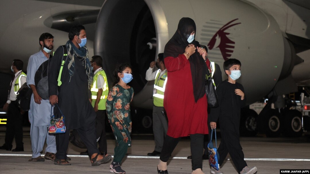 Evacuees from Afghanistan arrive at Hamad International Airport in Qatar's capital, Doha. 