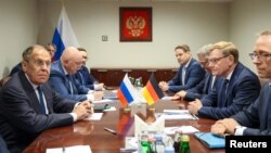 Russian Foreign Minister Sergei Lavrov (left) and his German counterpart, Johann Wadephul (second right) meet on sidelines of the UN General Assembly in New York on September 26.