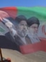 A flag bearing portraits of Iran's slain supreme leader Ali Khamenei and his son, the current supreme leader Mojtaba Khamenei, is seen installed along a street, a day before the funeral procession of Ali Khamenei in the holy Iraqi city of Karbala on July 
