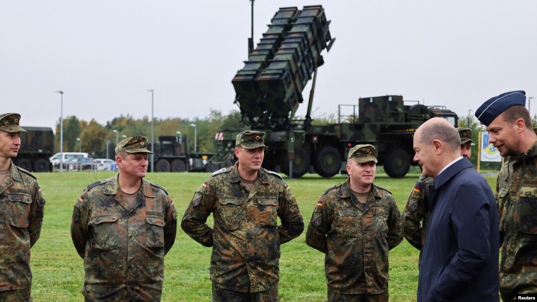 German Chancellor Olaf Scholz meets with members of the Patriot air-defense system unit as he visits the Cologne-Bonn Air Force on October 23.