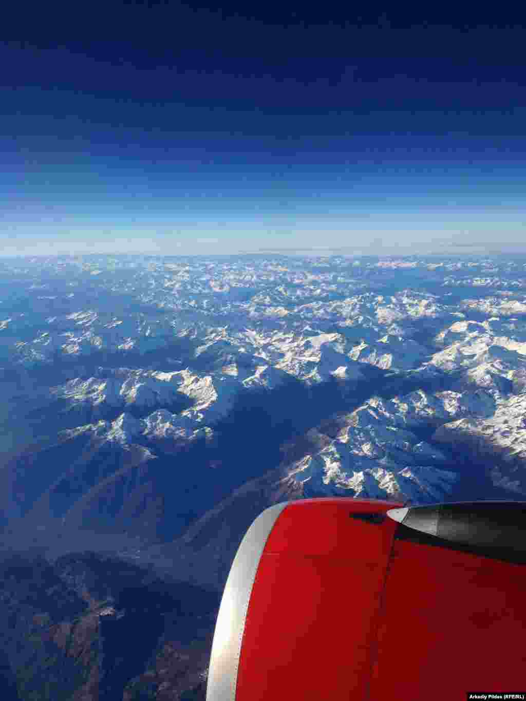 FINALIST:&nbsp;&quot;Alps and Airplane&quot;:&nbsp;A view of the Alps on a sunny day from an airplane. (Arkadiy Pildes, RFE/RL&#39;s Internet Technology Department)