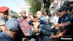 Armenia - Police detain an activist during protests against construction in Yerevan, 24Aug2013.