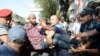 Armenia - Police detain an activist during protests against construction in Yerevan, 24Aug2013.