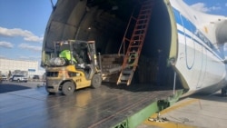 A worker unloads medical supplies from a Russian cargo plane at JFK airport in New York on April 1.