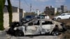 Un autovehicul incendiat de coloniștii israelieni în satul Jit din Cisiordania. 16 august 2024.