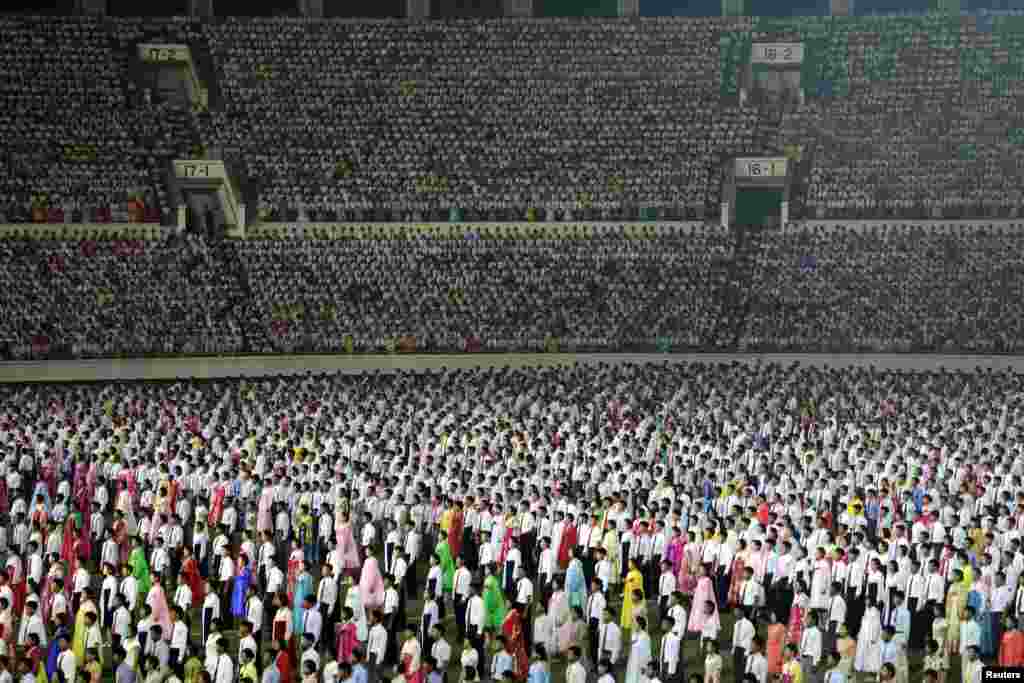 Thousands of North Koreans attend an event to commemorate the 60th anniversary of the signing of a truce in the 1950-53 Korean War at Kim Il Sung Stadium in Pyongyang. (Reuters/Jason Lee)