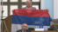 Oopposition Democratic Front deputy Jovan Vucurovic takes out a Serbian tricolor flag during a session of the Montenegrin parliament in Podgorica on March 4.