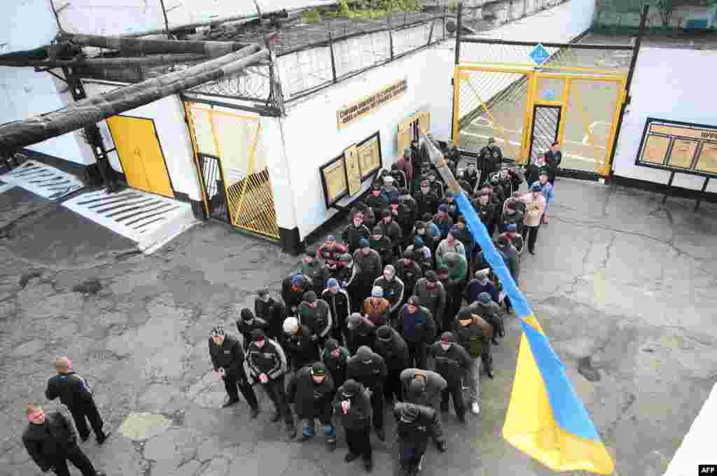 Prisoners march to an internal polling station at a prison in the eastern Ukrainian industrial city of Makeyevka.