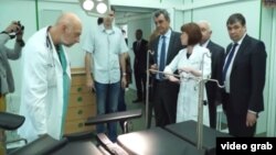 Sevastopol Governor Sergei Menyeilo (fourth from right) and the city's health department chief, Yury Voskanian (far right), attend the official opening of a new hospital operating theater on May 18. 