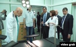Sevastopol Governor Sergei Menyeilo (fourth from right) and the city's health department chief, Yury Voskanian (far right), attend the official opening of a new hospital operating theater on May 18.