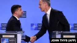 NATO Secretary-General Jens Stoltenberg (right) Ukrainian President Volodymyr Zelensky give a press conference after their bilateral meeting in Brussels on June 4. 