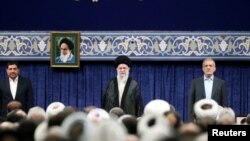 Iran's Supreme Leader Ayatollah Ali Khamenei and new President Masoud Pezeshkian attend an endorsement ceremony in Tehran, July 28, 2024.