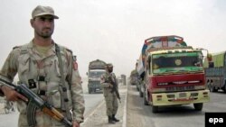 Pakistani soldiers patrol near the Afghan border.