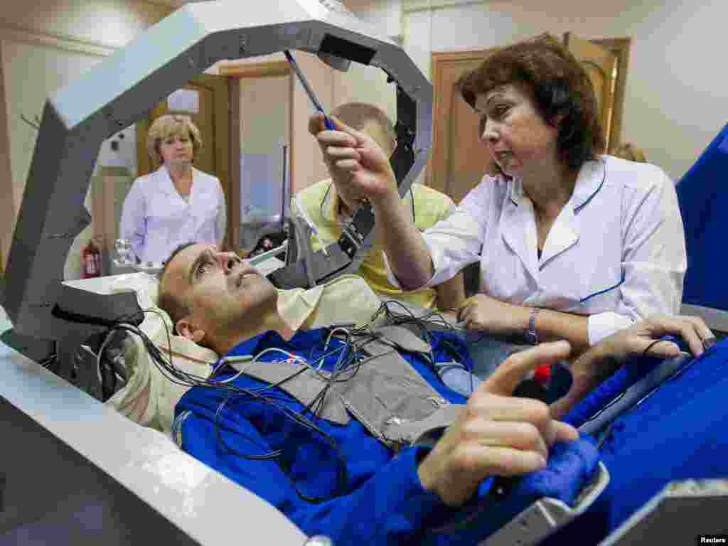 NASA astronaut Rick Mastracchio participates in a training exercise in a centrifuge at the Star City space center outside Moscow. Mastracchio is scheduled to be part of a mission to the International Space Station that will launch in November. (Reuters/Sergei Remezov)