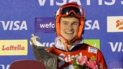 Александър Кръшняк на подиума в Бад Гашайн, Австрия, 13 януари 2025 г.